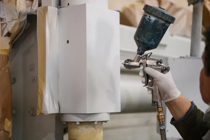 Multi coat protective paint system application on heavy steel structures
